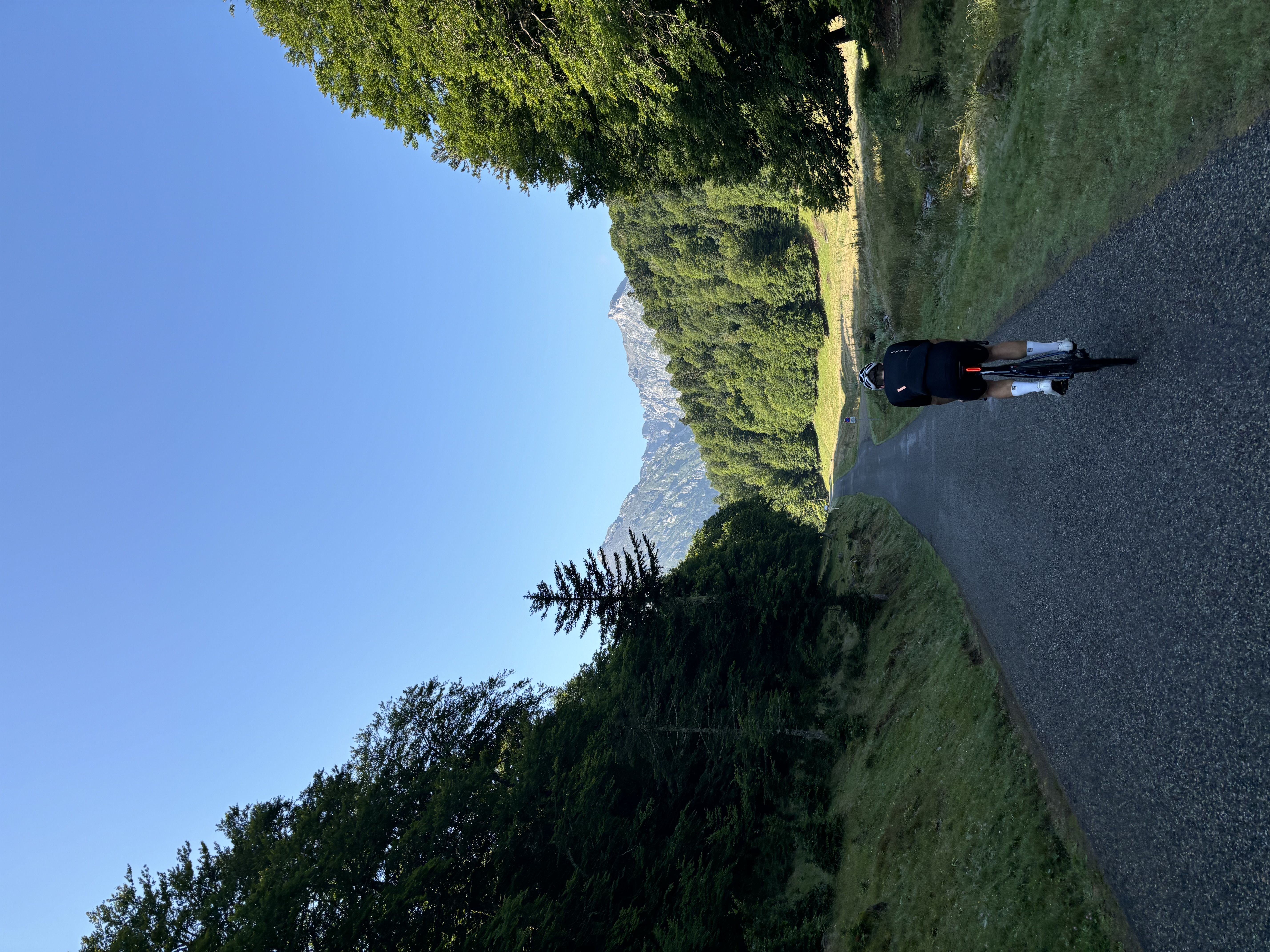Cyclist on a forested climb in France